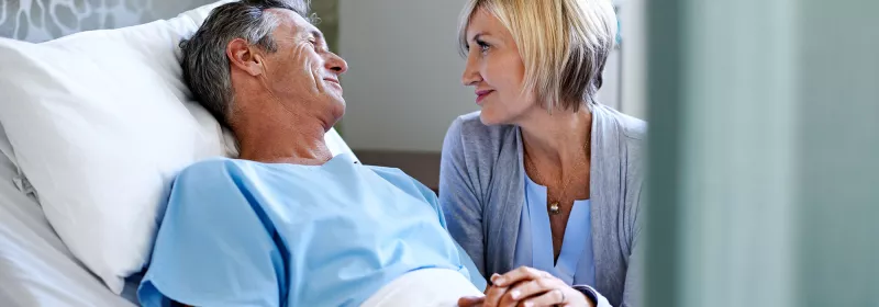 Woman visiting husband in the hospital.